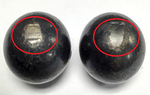 FIG. 2. Damaged balls with discoloration and flat spots 180° apart.